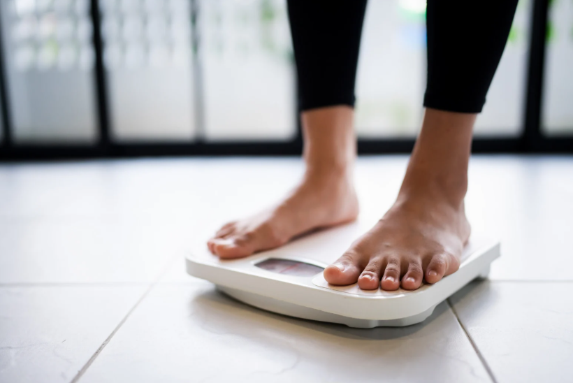 Runner training outdoors as part of a structured plan to lose weight through running